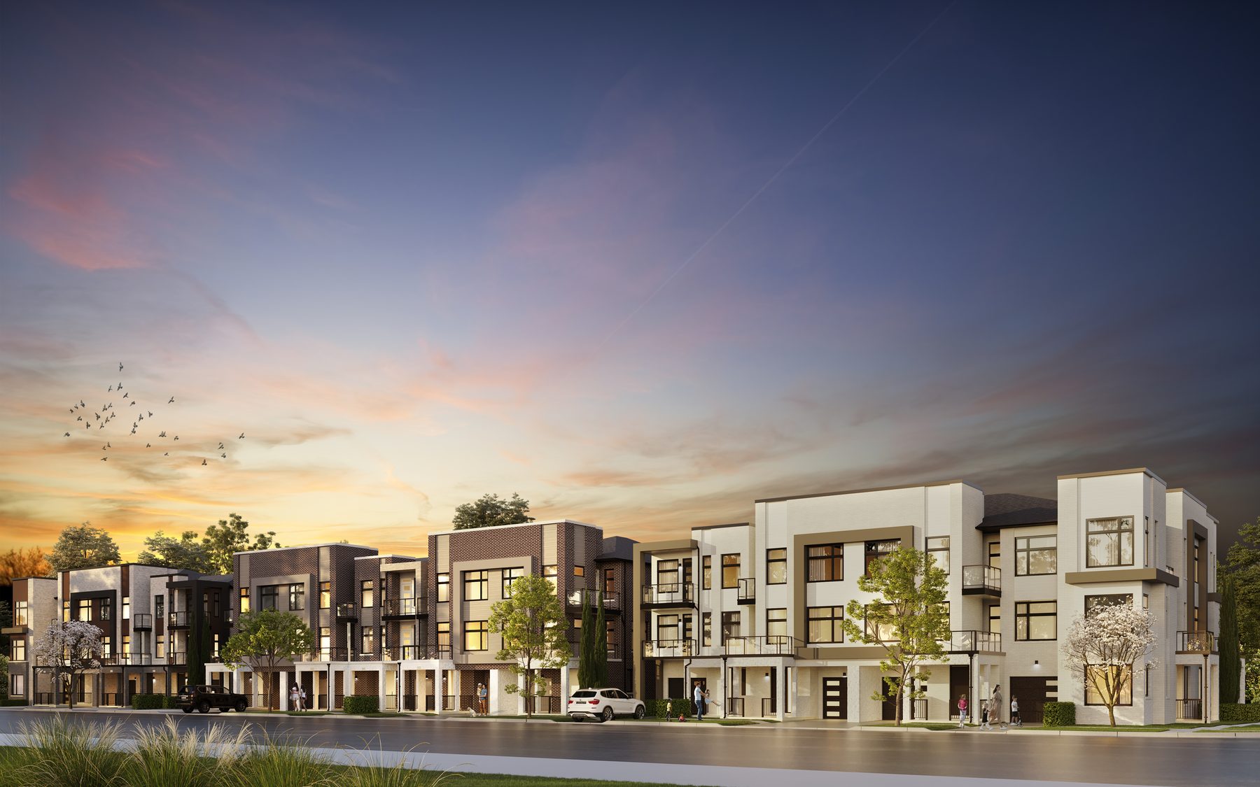 Joshua Creek Montage Hallett modern townhouses along a street at dusk (artist's concept)