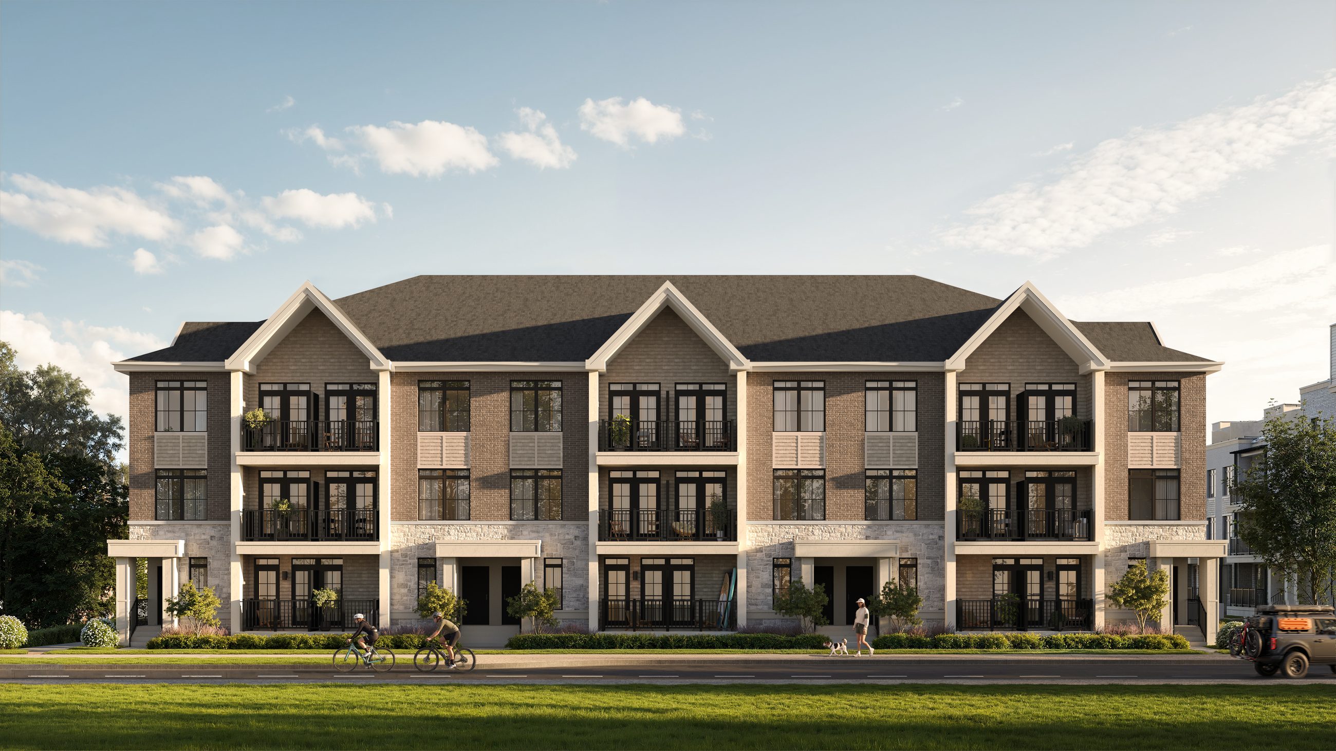 Front elevation of a three-storey coastal townhome block with gabled rooflines, balconies and a grassy foreground (artist's concept)