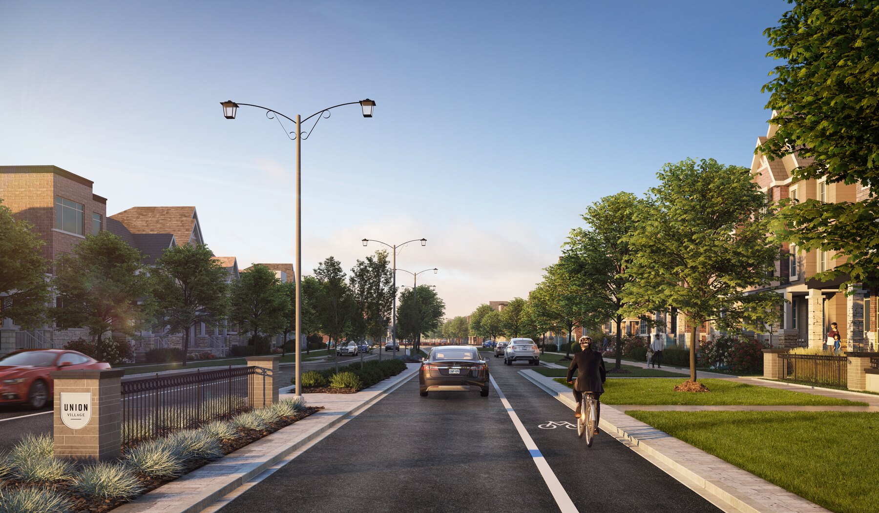 Union Village streetscape with a cyclist and a community sign (artist's concept)