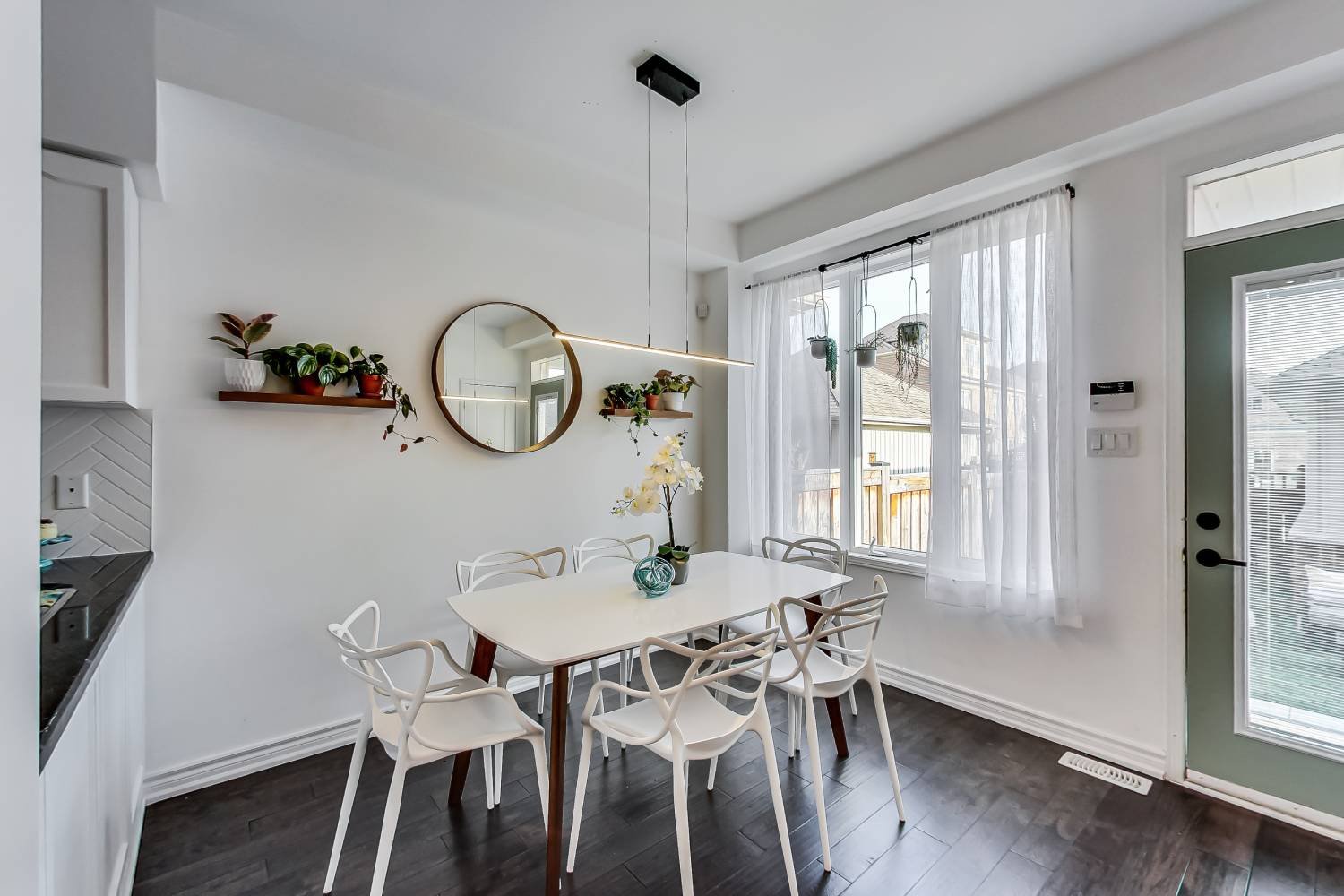 A bright, staged dining room in a Toronto home sold by the team