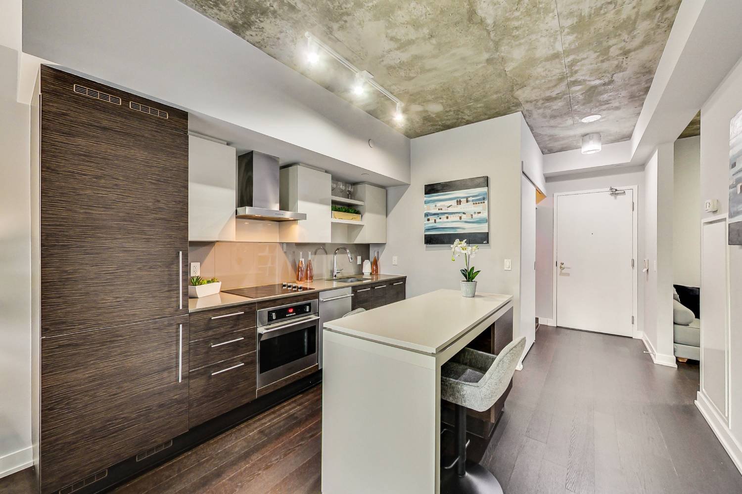 Floor-to-ceiling windows framing a downtown Toronto skyline in a home the team has sold